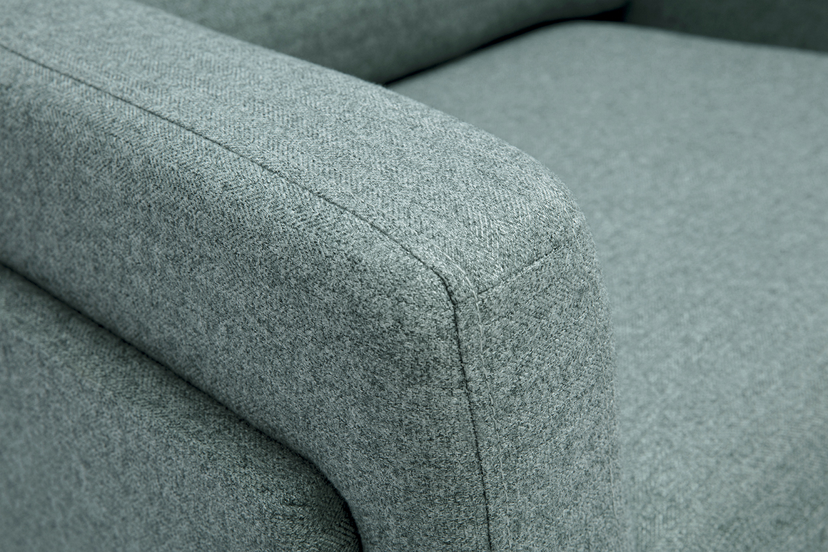 Gros plan sur le tissu vert de gris du fauteuil design MOSCO.